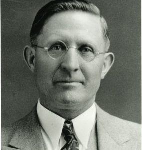 Photo of Abel S Rich wearing a suit and tie