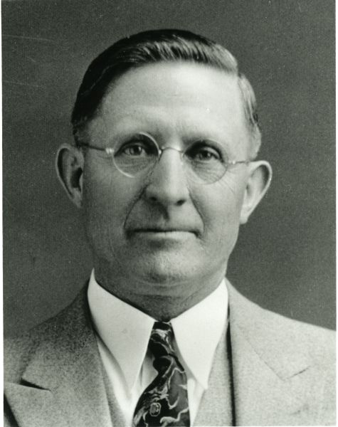 Photo of Abel S Rich wearing a suit and tie
