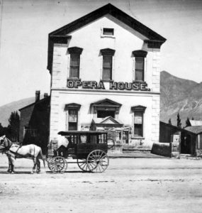 Image of the Brigham City Opera House with a carriage in front