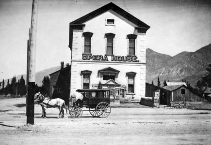 Image of the Brigham City Opera House with a carriage in front
